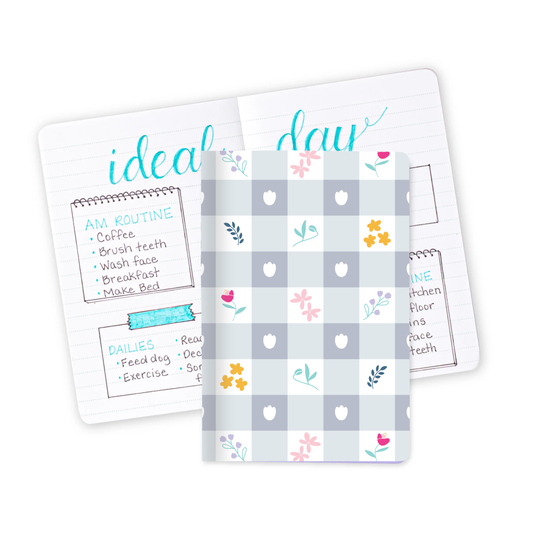 The Gingham Floral Mini Notebook, and an open version behind it full of notes.