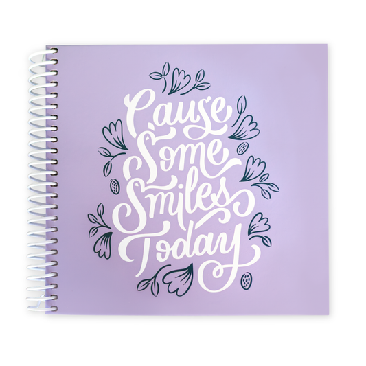Purple planner with 'Cause Some Smiles Today' text on a white background