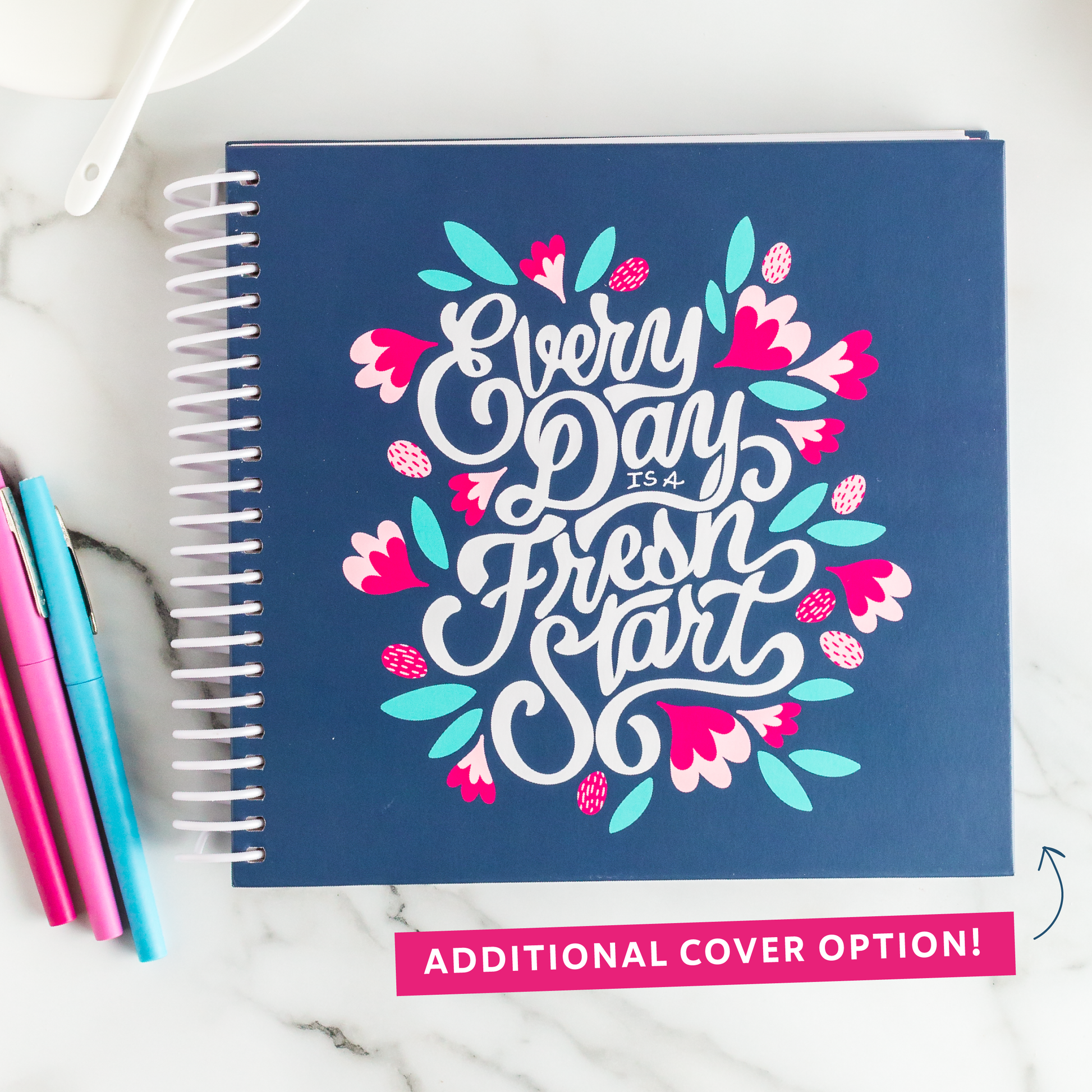 Additional cover option: Navy planner with 'Every Day is a Fresh Start' design on a marble surface with pens.