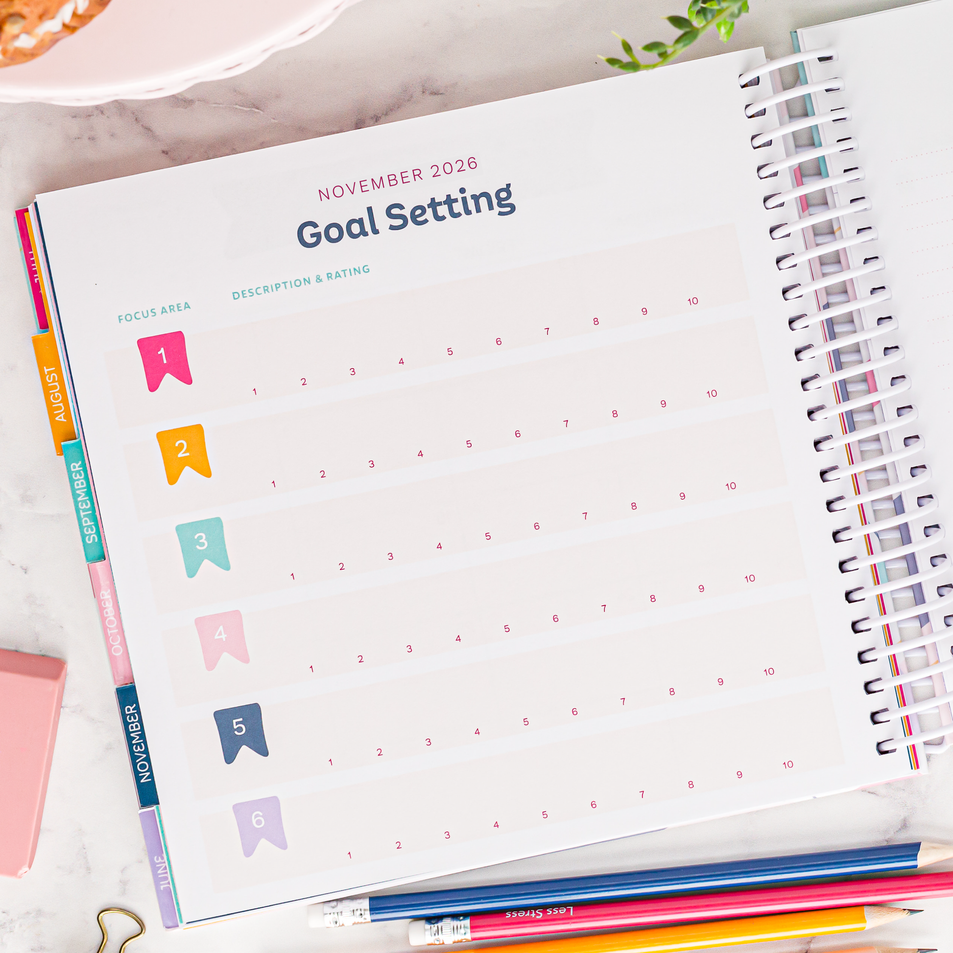 Colorful goal setting page on a marble surface