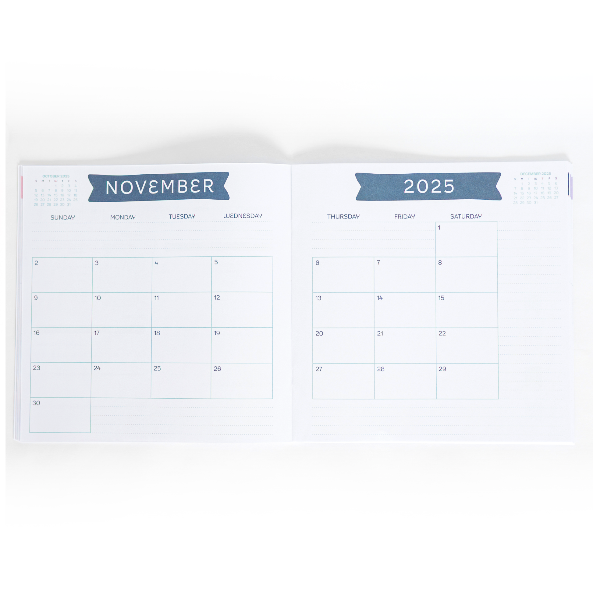 Calendar booklet open to November 2025 on a white background