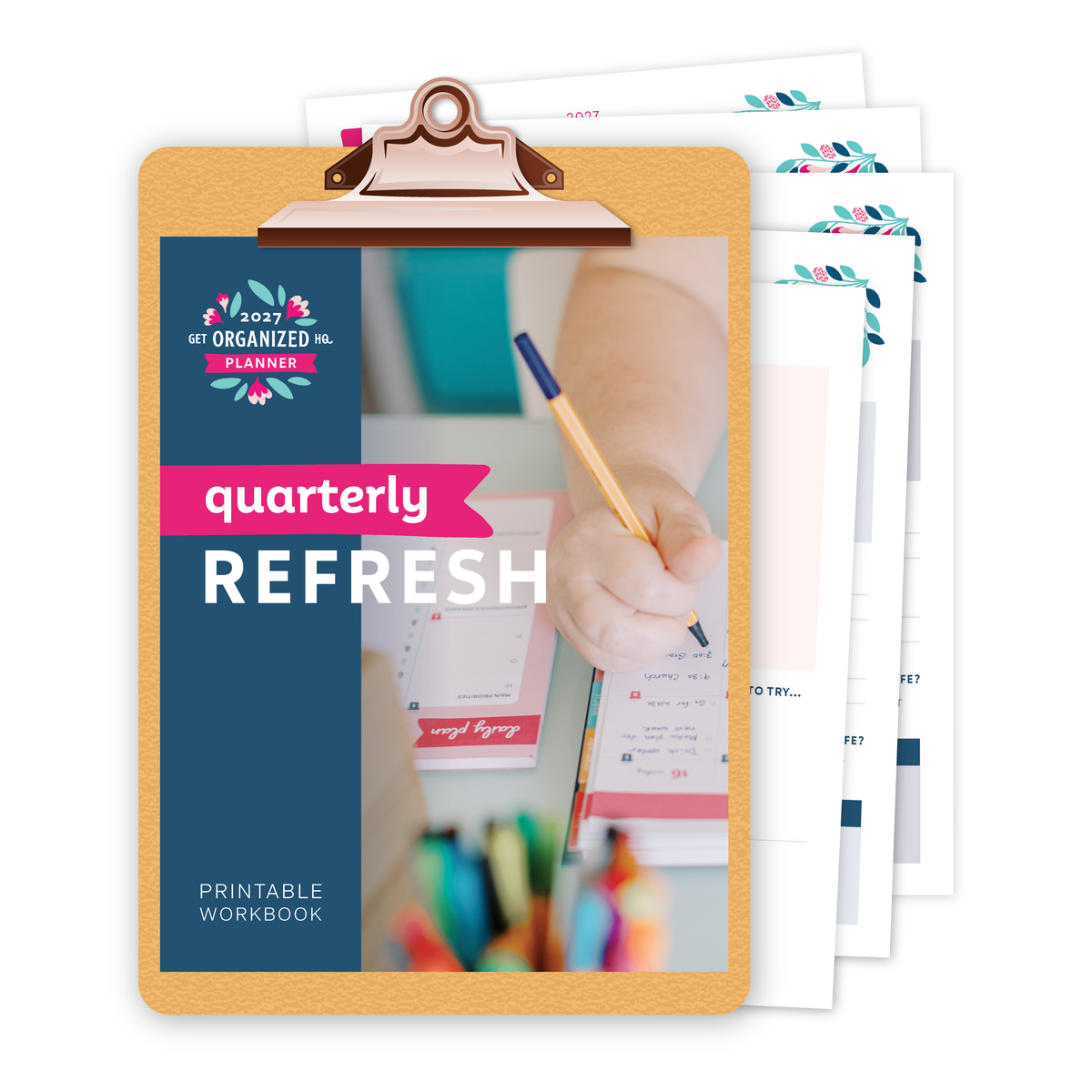 Clipboard with a printed 2027 Get Organized HQ Planner Quarterly Refresh Printable Workbook on it and scattered behind it.