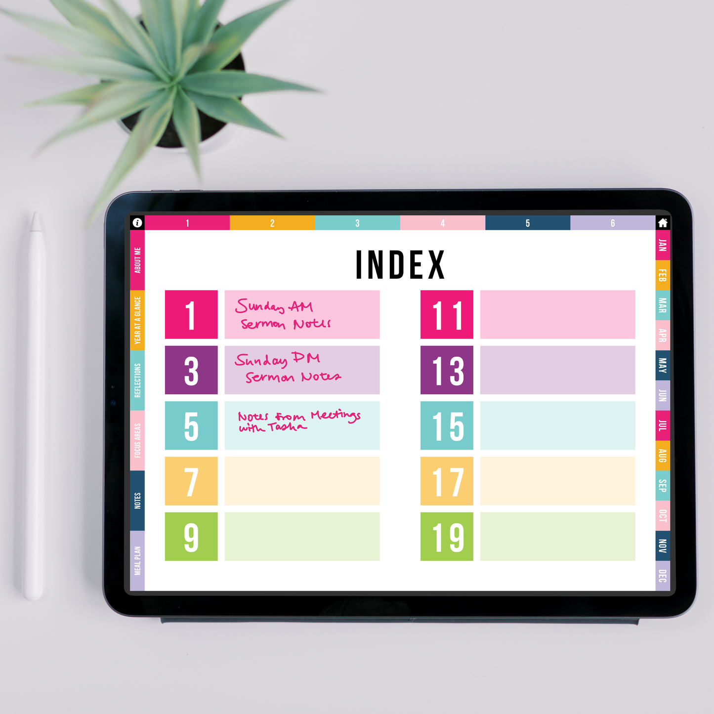 Digital planner on a tablet with colorful index layout