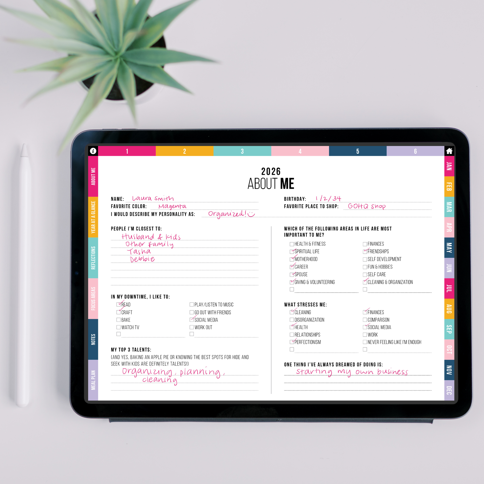 Digital planner on a tablet with 'About Me' section displayed, placed on a white surface with a plant in the background.